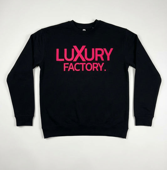 Black sweatshirt with pink 'LUXURY FACTORY' text on a white background