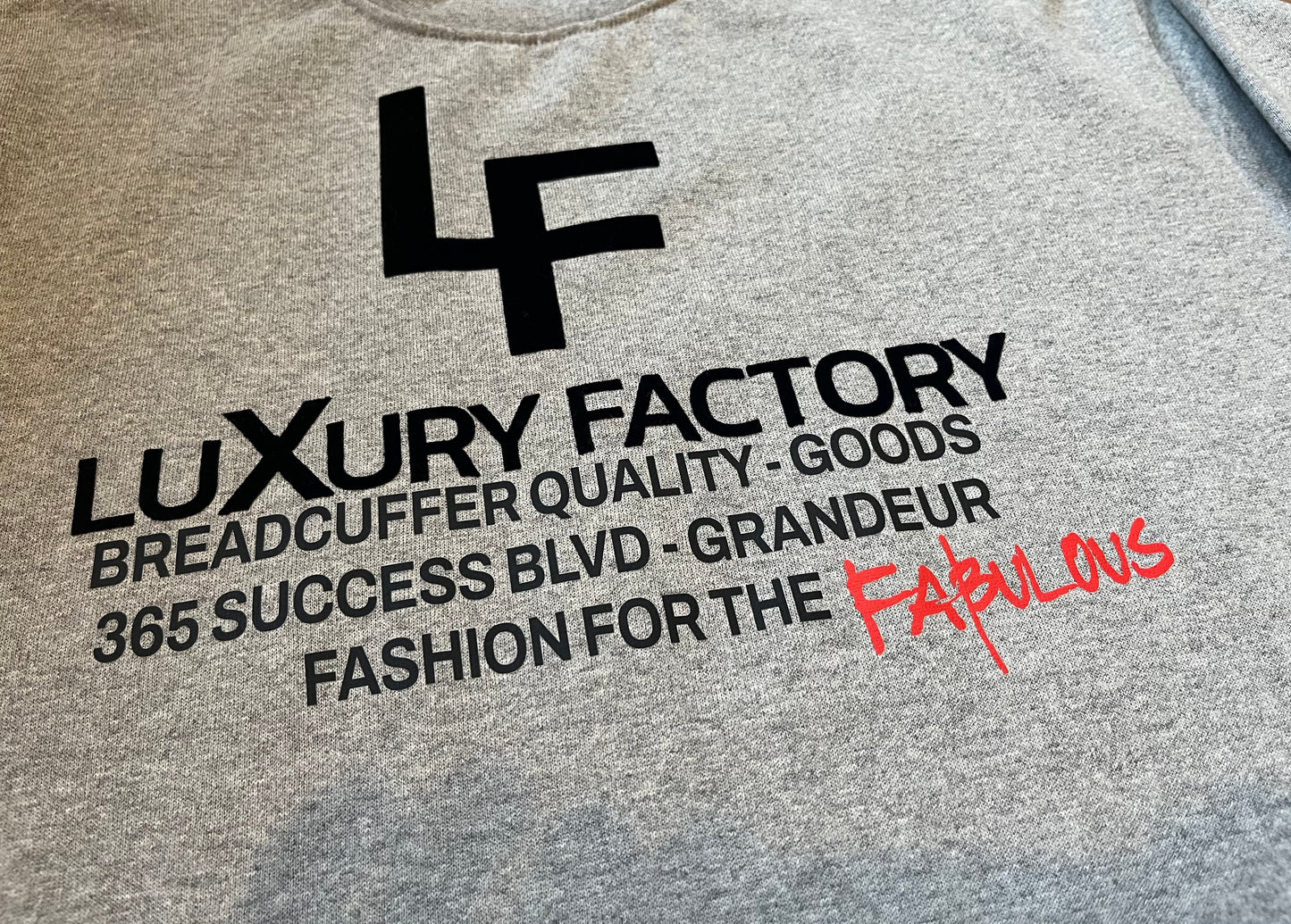 Text and logo on a gray background with 'Luxury Factory' branding.