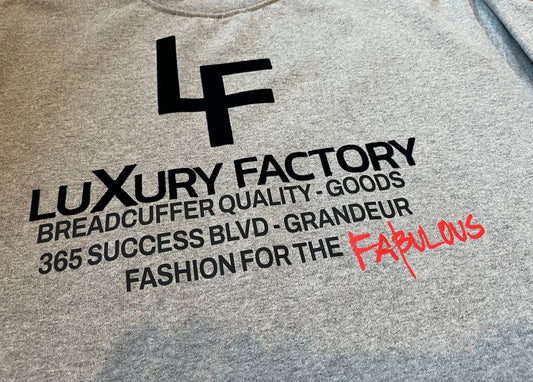 Text and logo on a gray background with 'Luxury Factory' branding.